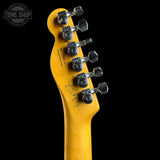 Guitar headstock with tuning pegs on a black background, featuring the Tone Shop logo.