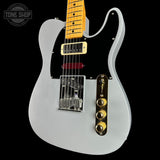 Electric guitar with a silver body and yellow pickguard on a black background, featuring 'Tone Shop' branding.
