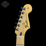 Fender Stratocaster guitar headstock on a black background