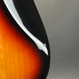 Close-up of a guitar's body with a gradient background