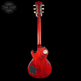 Red electric guitar on a black background with 'Tone Shop' logo.