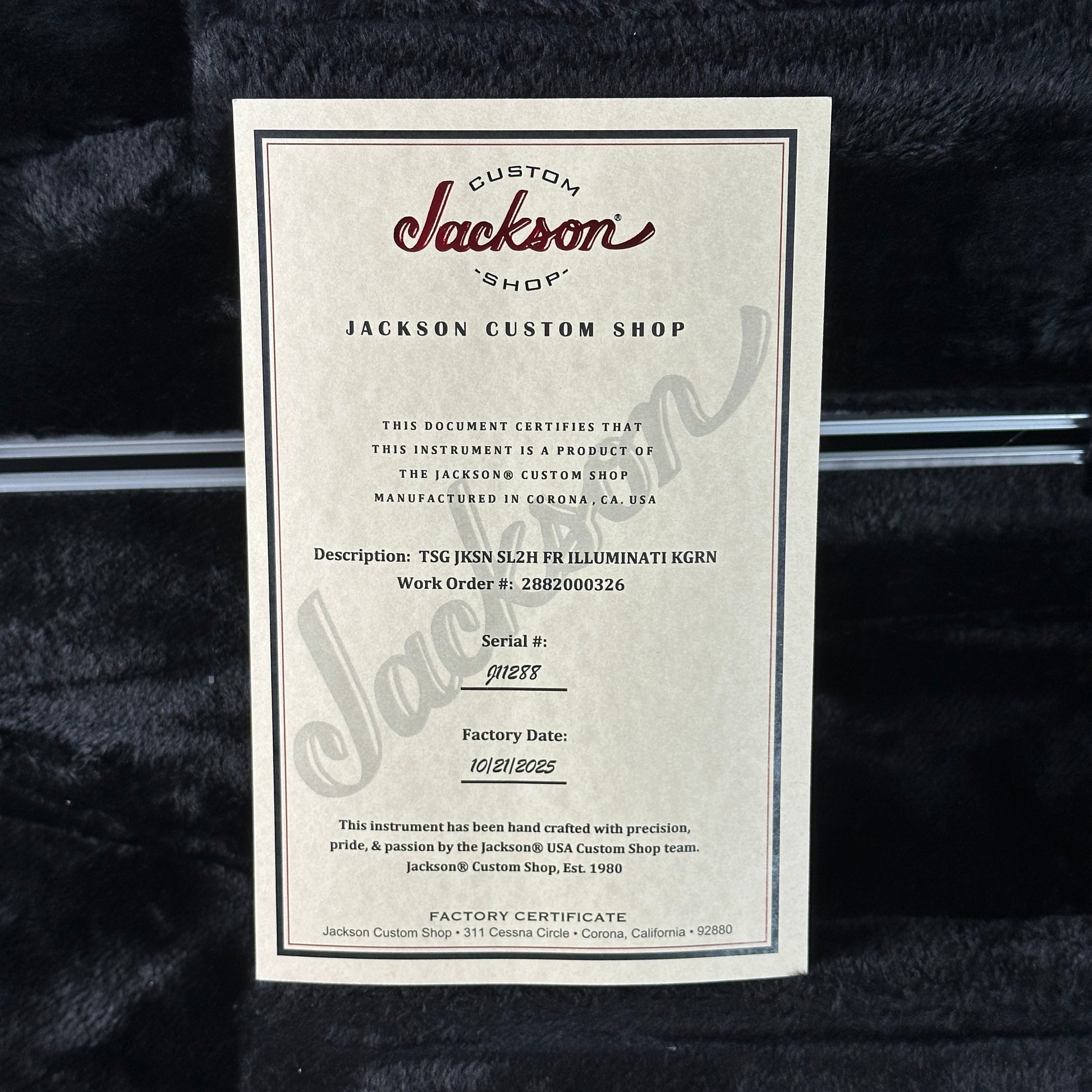 Jackson Custom Shop guitar certificate on a textured black surface