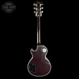 Back view of a guitar with a visible brand logo in the corner.