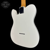 White electric guitar body with a visible brand logo on a black background