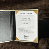 Gibson Custom Certificate of Authenticity on a textured surface