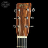 Guitar headstock with Martin & Co logo on a black background