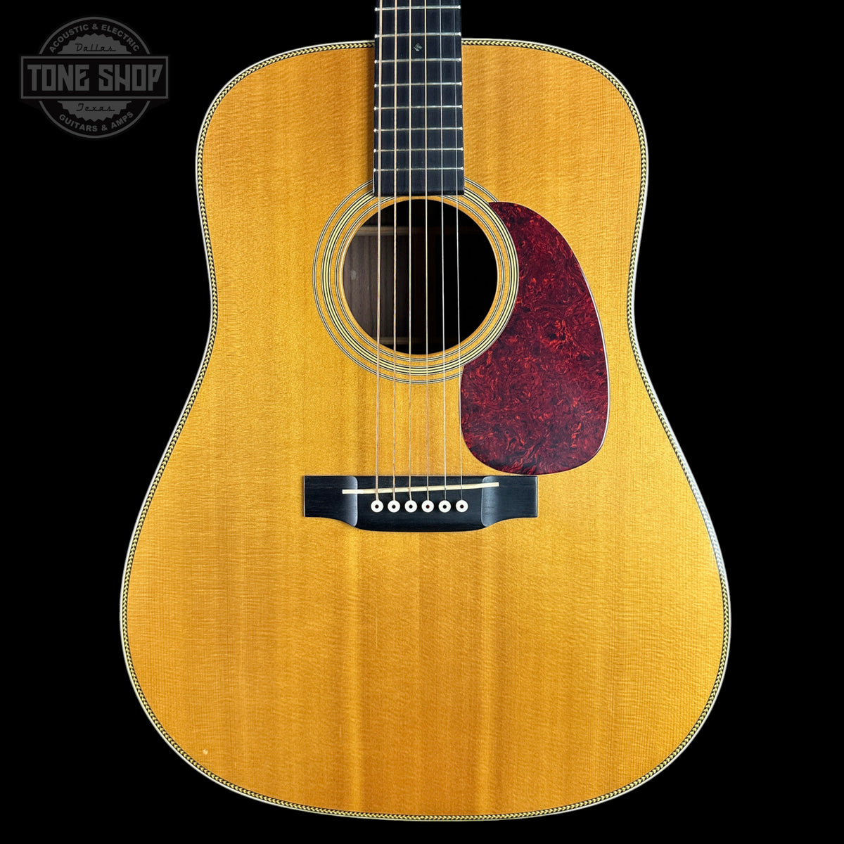 Acoustic guitar with a visible brand logo on a white background