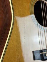 Close-up of an acoustic guitar's soundhole and body