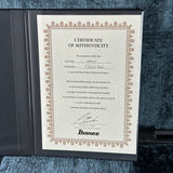 Ibanez certificate of authenticity on a textured surface