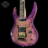 Purple electric guitar with a black background