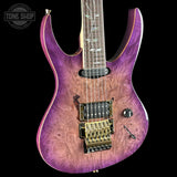 Purple electric guitar with a visible brand logo in the corner