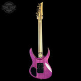 Purple electric guitar with gold hardware on a black background, featuring 'Tone Shop' branding.