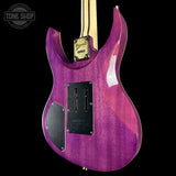 Purple electric guitar with a visible brand logo on a black background