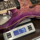 Guitar on a digital scale displaying weight