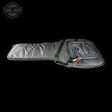 Guitar case with a visible brand logo on a black background