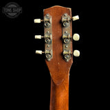 Guitar headstock with tuning pegs on a black background, featuring 'Tone Shop' logo.