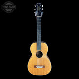 Acoustic guitar with 'Harmony' branding on a black background
