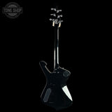 A glossy black electric guitar shown from the back against a solid black background, with a Tone Shop watermark in the upper left corner.