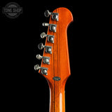 Guitar headstock with tuning pegs on a black background, featuring 'Tone Shop' logo.