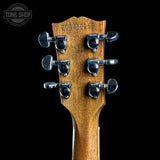 Guitar headstock with tuning pegs on a black background, featuring 'Tone Shop' logo.