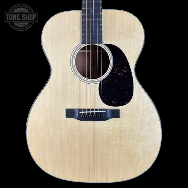 Acoustic guitar with a visible brand logo in the corner