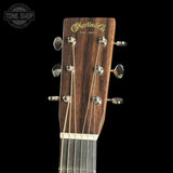 Guitar headstock with 'Martin & Co' branding on a black background