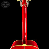 Close-up rear view of a glossy red acoustic guitar body and neck joint against a black background, with a Tone Shop watermark in the upper left.
