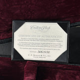 Certificate of authenticity for a Martin guitar on a maroon background