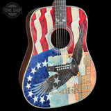 Acoustic guitar with American flag and eagle design on a black background