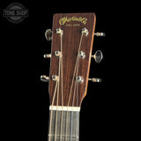 Guitar headstock with Martin & Co logo on a black background