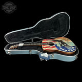 Acoustic guitar with American flag design in a hard case, branded 'Tone Shop'.