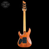 A rear view of a six-string electric guitar with a glossy amber-brown wood finish, black pickups, and a black pickguard, shown against a solid black background with a Tone Shop watermark in the top-left corner.