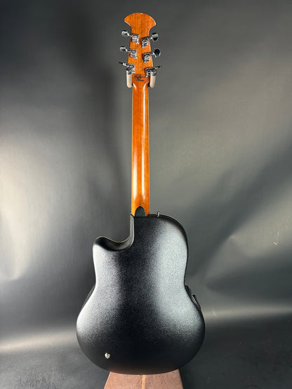 Guitar headstock and neck on a dark gray background