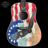 Acoustic guitar with American flag and eagle design on a black background