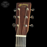 Guitar headstock with Martin & Co logo on a black background