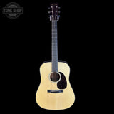 Acoustic guitar on a white background with 'Tone Shop' logo.