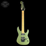 A green electric guitar with a natural wood neck and black hardware, shown against a solid black background with a Tone Shop logo in the top left corner.
