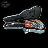 Guitar with American flag design in a hard case, branded 'Tone Shop'.