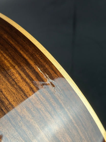 Damage on bottom of Used Taylor 812ce Natural.