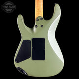 The back of an electric guitar with a sage green body, black pickups, and a natural wood neck, shown against a black background with a Tone Shop watermark in the top left corner.