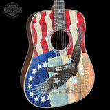 Acoustic guitar with American flag and eagle design on a black background