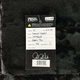 PRS Guitars label on a textured black background