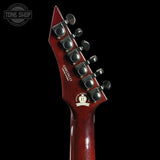 Close-up of the headstock of a Fender Custom '52 electric guitar in a glossy dark red finish, featuring six silver tuning pegs and a white Fender logo on a black background.