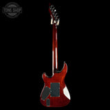 A high-end electric guitar shown from the back, featuring a glossy dark red cherry finish, black pickups, and white pickguard accents, set against a solid black background with a Tone Shop watermark in the top left.