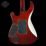 The back of a double-cutaway electric guitar with a glossy reddish-brown cherry finish, black pickguard covers, and a white binding edge, shown against a black background.