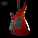 The back of an electric guitar with a glossy reddish-brown cherry finish, featuring black hardware covers and a black background.