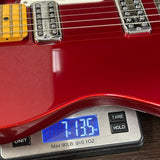 Used 2025 Fender 75th Anniversary Cabronita American Pro Tele Candy Apple Red on scale displaying weight.