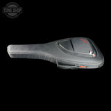 A black padded guitar or bass gig bag with a zippered top pocket and small red logo details, shown on a solid black background. A Tone Shop watermark is visible in the upper left corner.