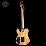 A Fender Telecaster electric guitar shown from the back, featuring a natural wood finish and black hardware, set against a solid black background with a Tone Shop watermark in the top left corner.