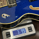 Used Duesenberg Starplayer Blue Sparkle on scale displaying weight.